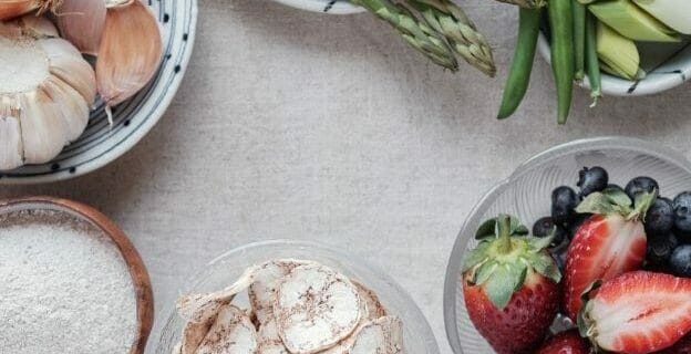 bowls of food on plain table - how to live frugally newly frugal