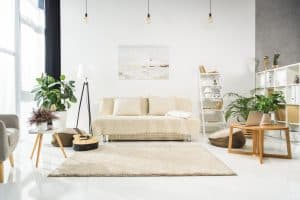 Beautiful living room with pale furnishings to signify how to be a homemaker.